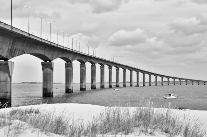 Welcome to the bridge of Île de ré in this black and white scene with red skin tone